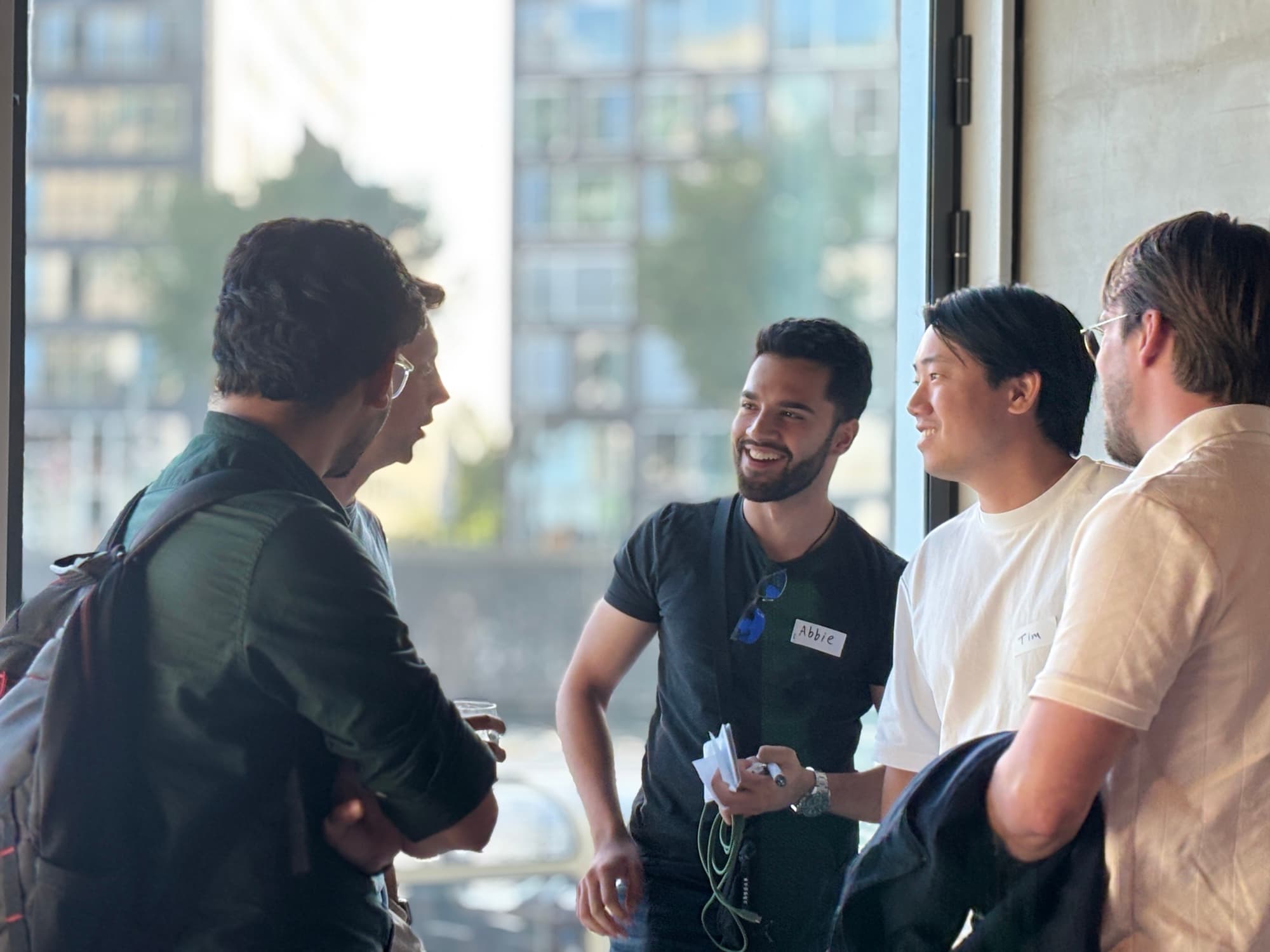 Founders laughing together at a Startup Valley networking night in Amsterdam