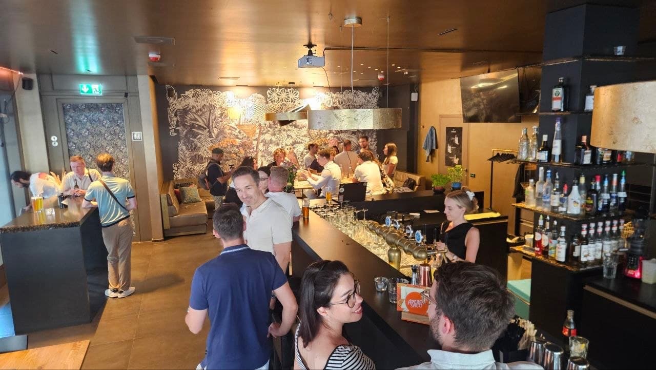 Founders and investors networking across the bar at MINI Café Bar in Zurich