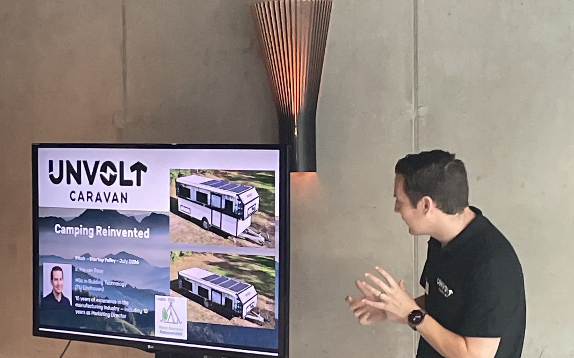 A founder pitching their startup on stage at a Startup Valley pitch night in Amsterdam