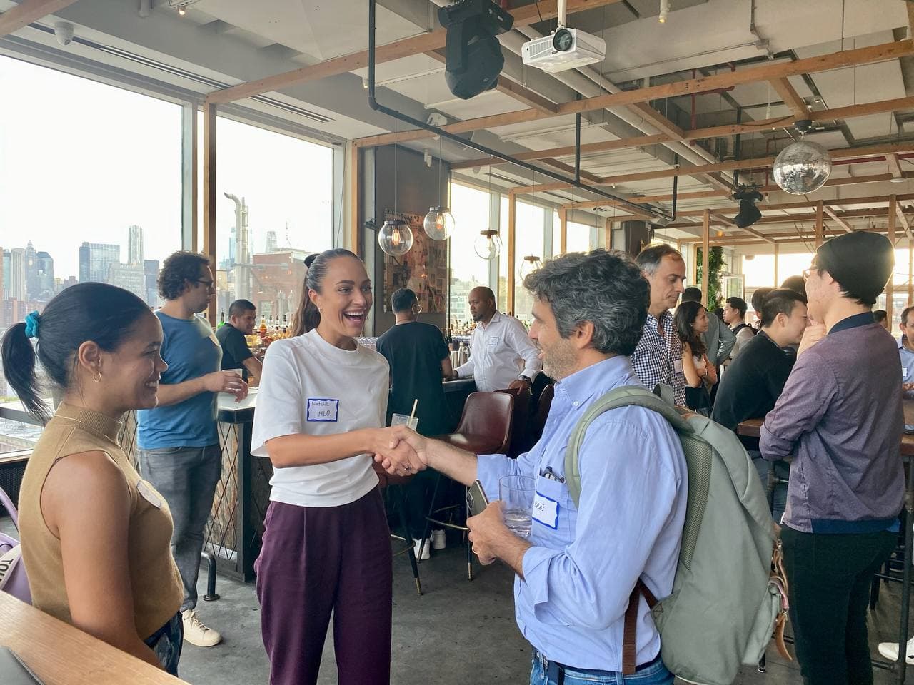 Investors and founders shaking hands at a Startup Valley event